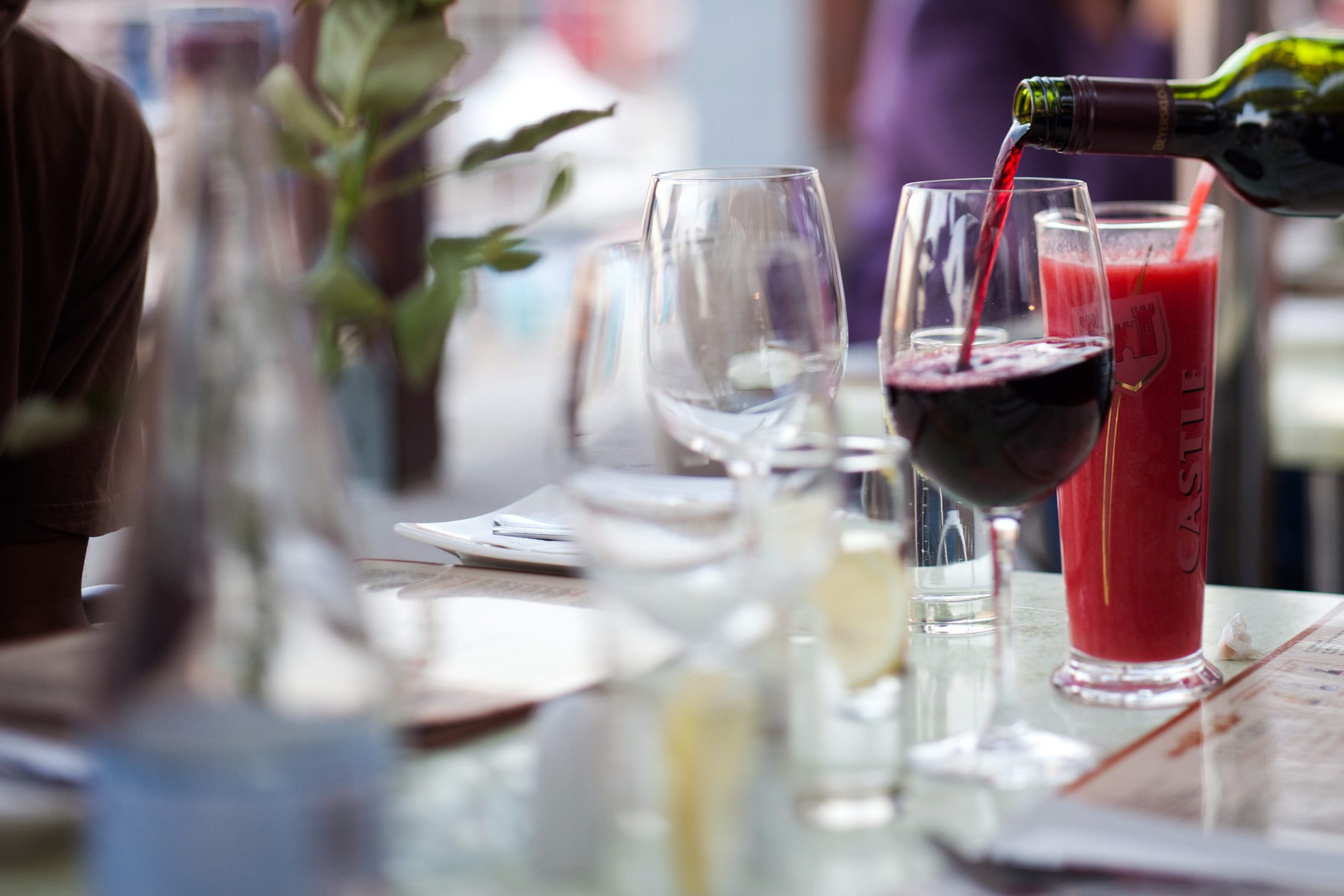Pouring South African red wine at the Victoria and Alfred Waterfront, Cape Town, South Africa