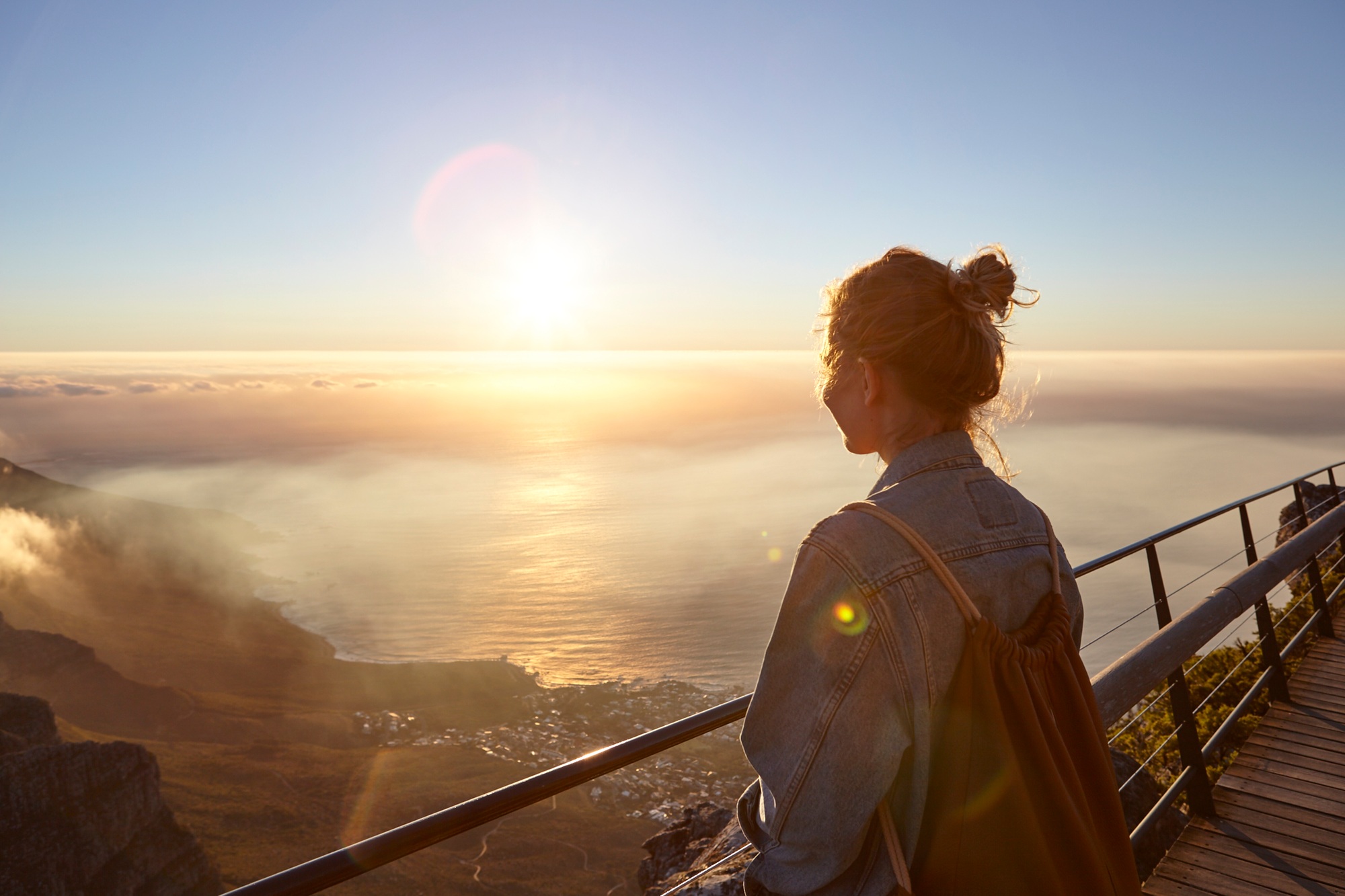 Young woman on top of Table Mountain, looking at view, Table Mountain, Cape Town, South Africa